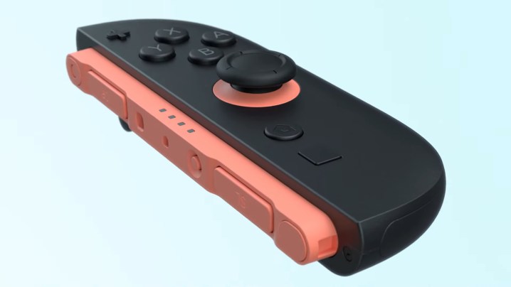 Un Joy-Con de la Switch 2 noir et rose.