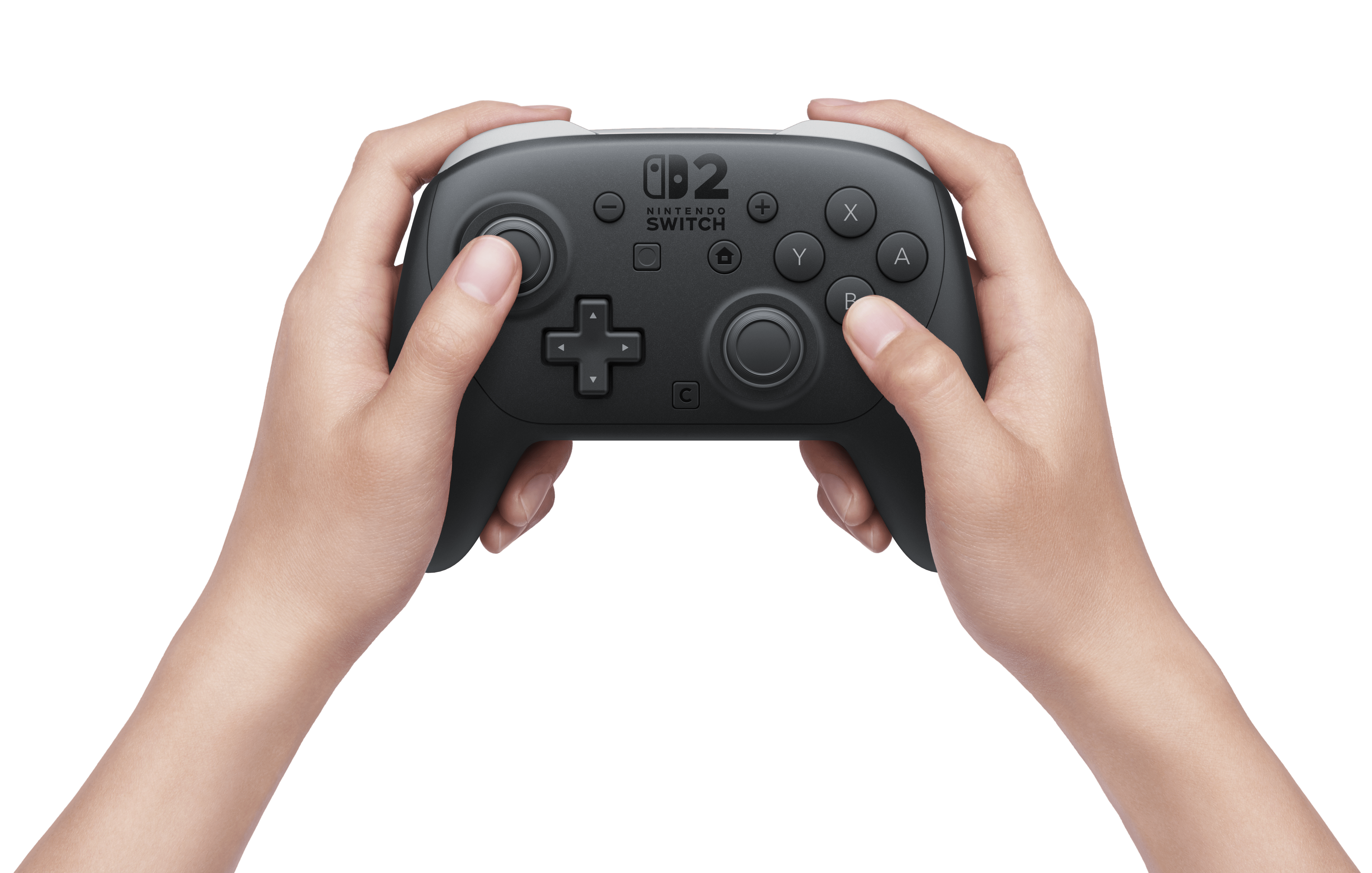 Des mains tiennent un contrôleur Pro Switch 2.