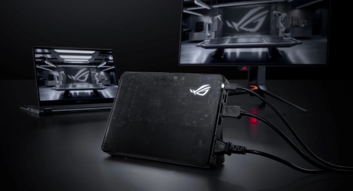 The Asus ROG XG Mobile 2025 eGPU connected to a laptop and monitor
