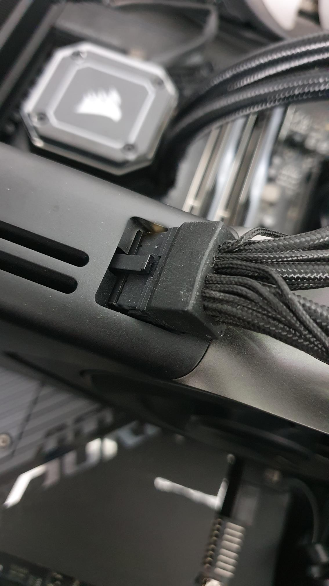 Close-up of a computer cable connection inside a PC build for effective power management.
