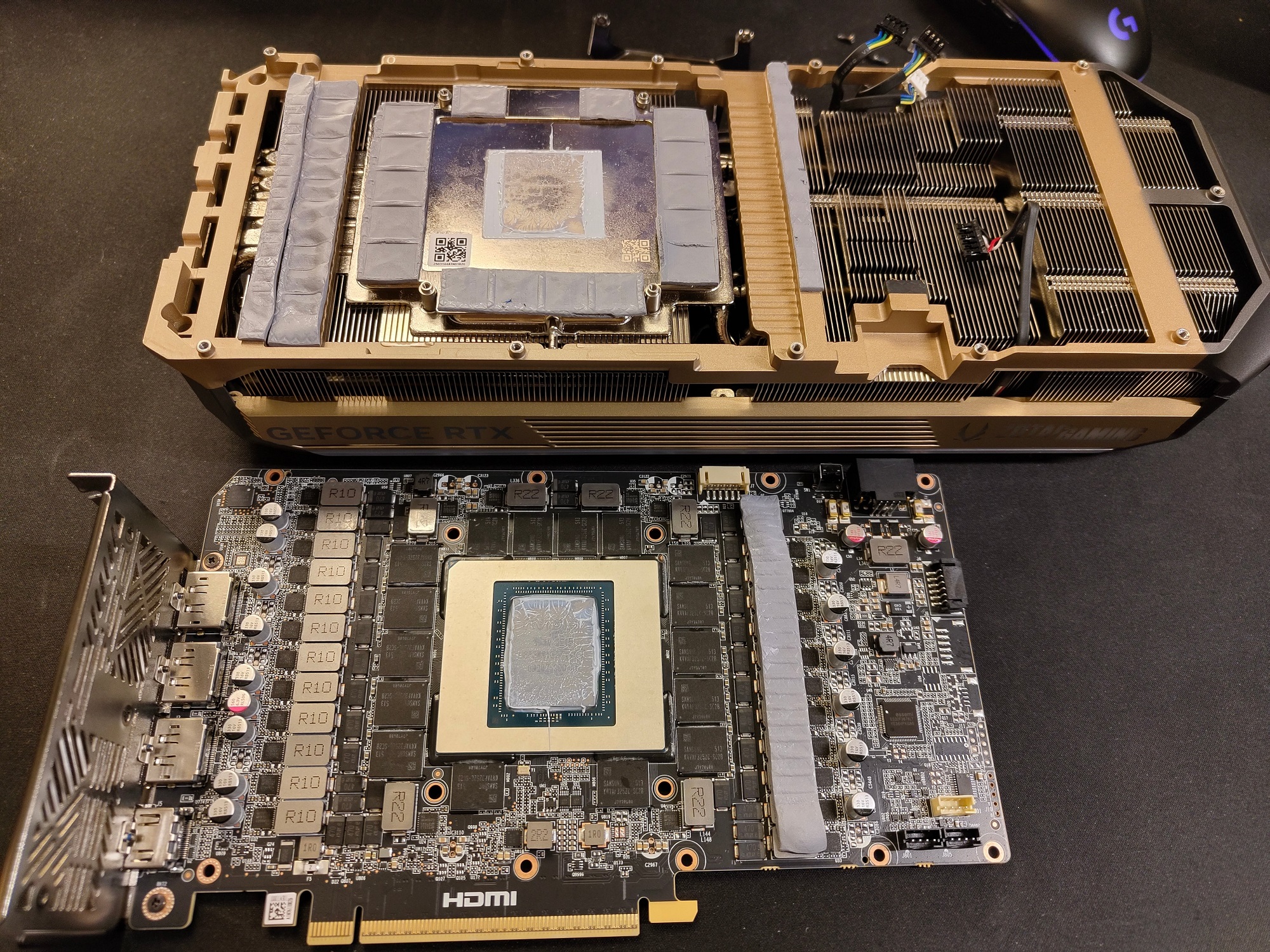 Disassembled NVIDIA GeForce RTX graphics card on a desk, showing internal components.