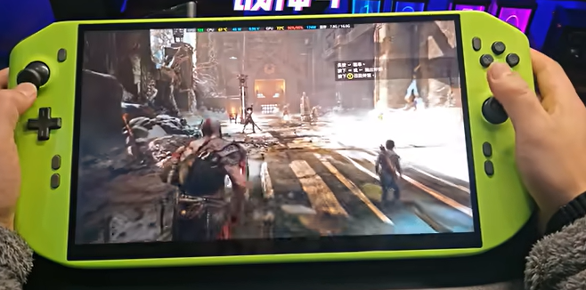 Person playing a video game on a large handheld device with bright green controls.