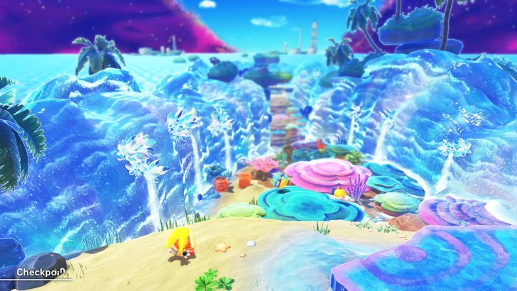 Colorful fantasy beach scene in Kirby game