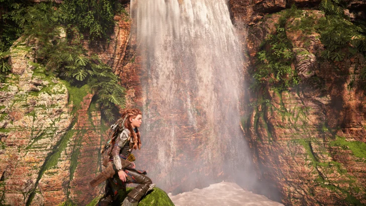 Character near lush waterfall and mossy cliff in a vibrant natural landscape.