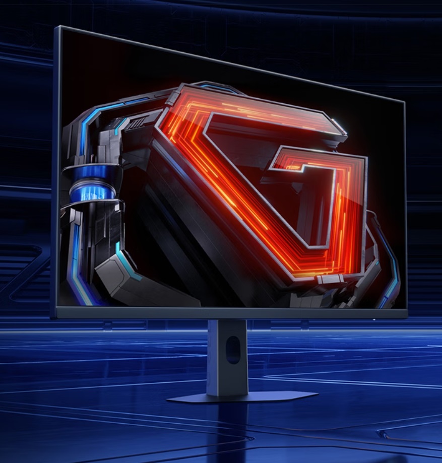 Moniteur Gigabyte affichant un logo futuriste sur fond technologique.