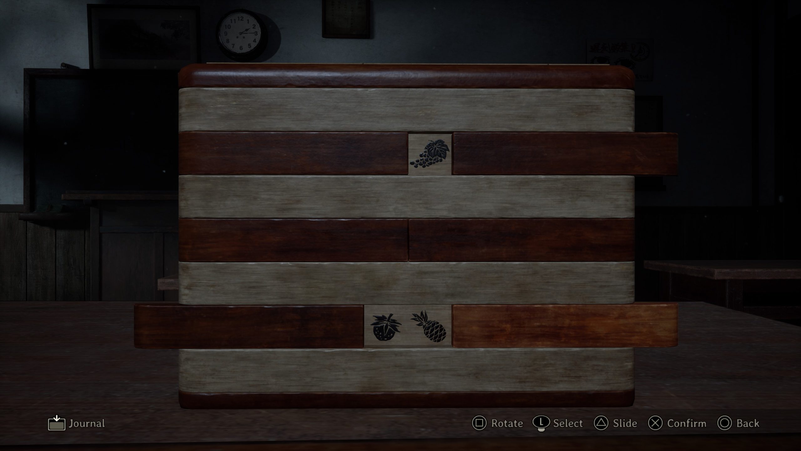 Boîte de puzzle avec symboles de fruits.