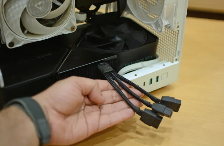 The 12VHPWR 16-pin power connector connected to an RTX 4080 Super Founders Edition inside a mini-ITX PC