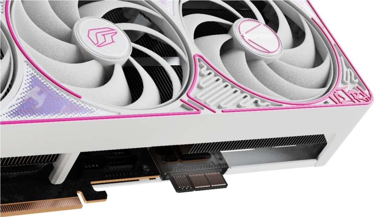 Une carte graphique Spectre KFAN3 blanche et rose avec des ventilateurs et un connecteur PCIe visible.