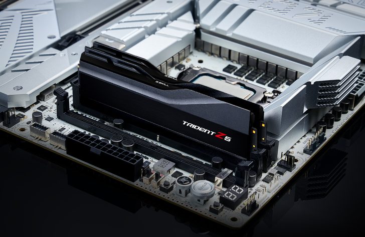A close-up view of a G.Skill Trident Z5 RAM module installed on a high-end computer motherboard with metallic heatsinks.