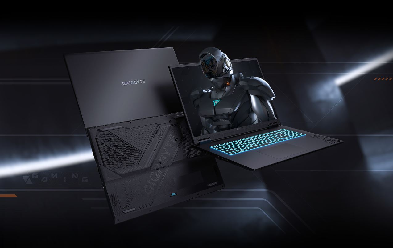 Un ordinateur portable de jeu Gigabyte avec un clavier lumineux affichant un personnage futuriste sur son écran.