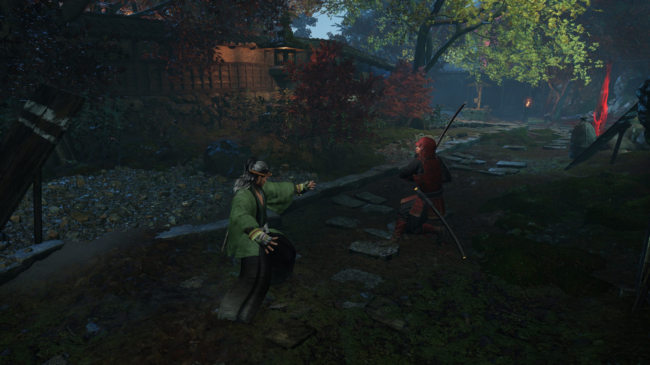 Deux personnages en tenue de samouraï s'affrontent dans Nioh 3.