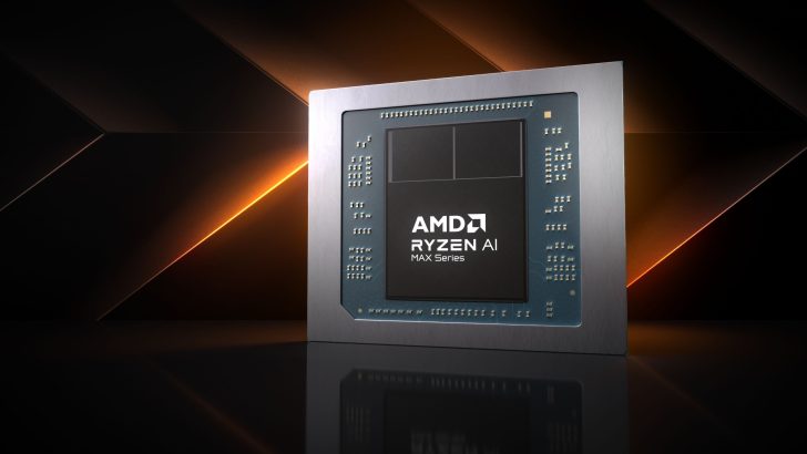 Un puce AMD Ryzen AI Max Series est affichée sur un arrière-plan géométrique sombre avec des accents orange.