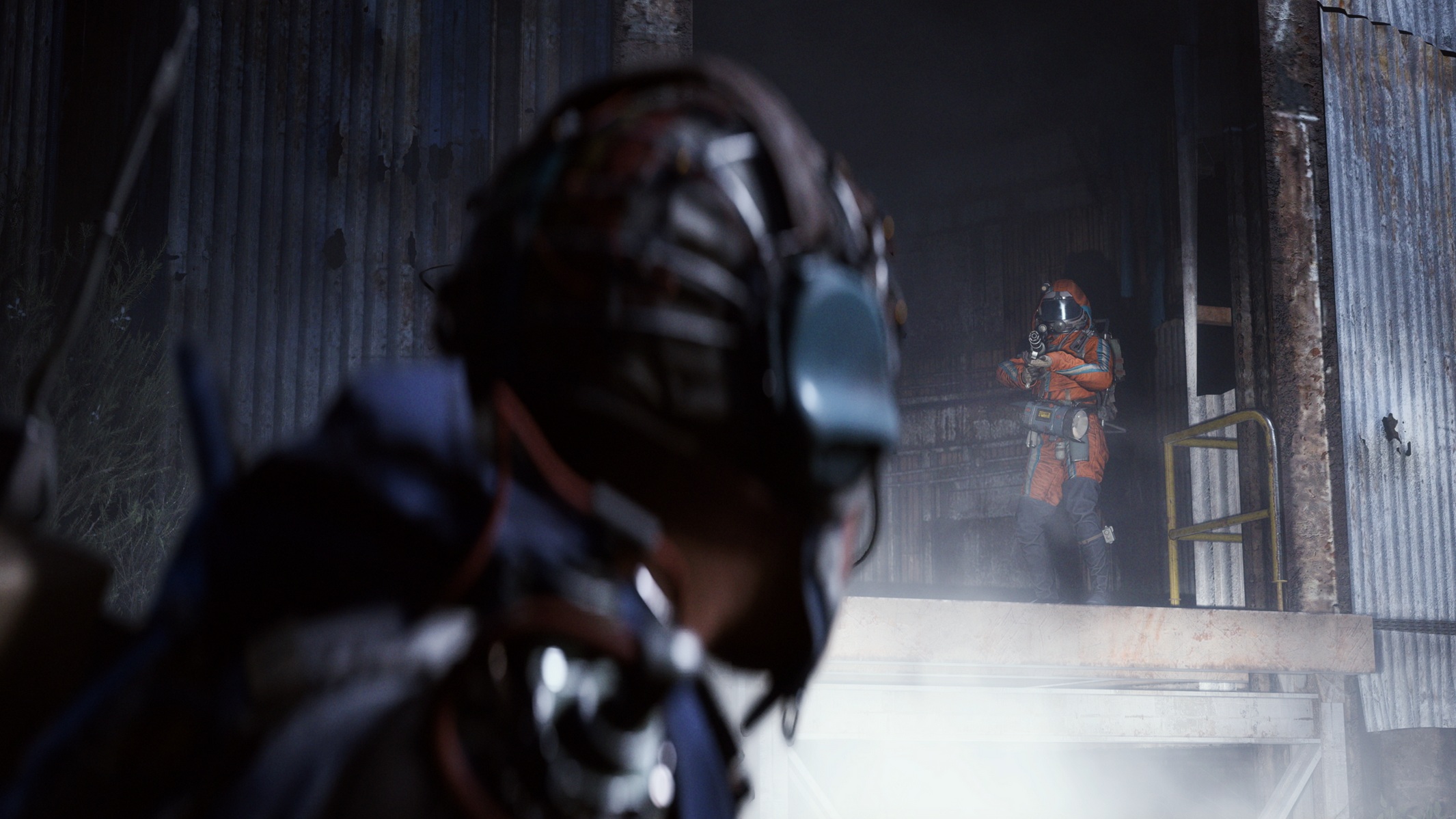 A character in an orange spacesuit holds a weapon while standing in a dilapidated industrial setting in the video game 'ARC Raiders.'