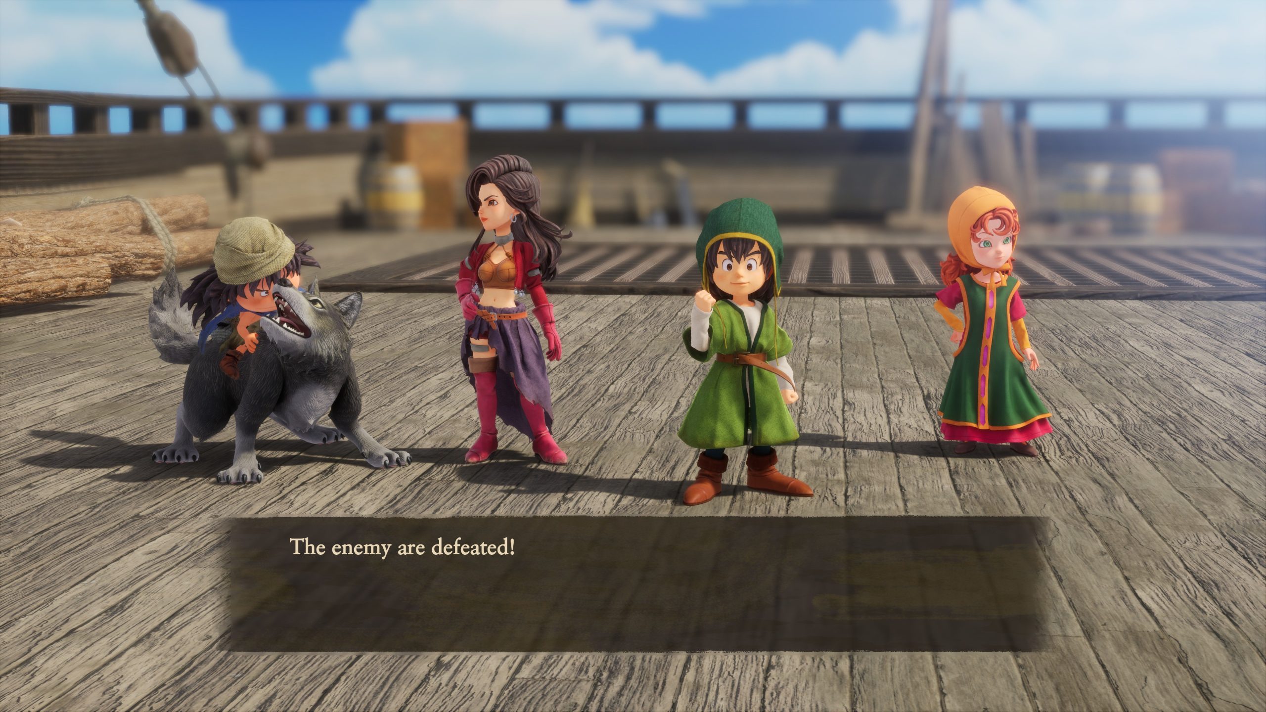 Quatre personnages de Dragon Quest VII Reimagined se tiennent victorieux sur le pont en bois d'un bateau avec le texte 'L'ennemi est vaincu !' affiché.