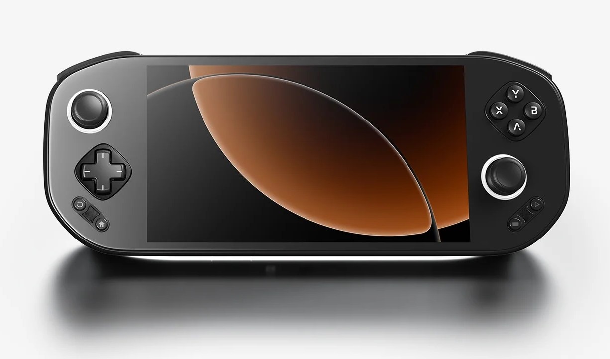 A handheld gaming console with a black body, featuring a screen displaying a simple orange and black abstract design