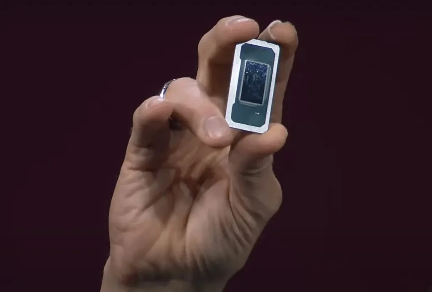 Intel CEO Pat Gelsinger holding a Panther Lake chip.