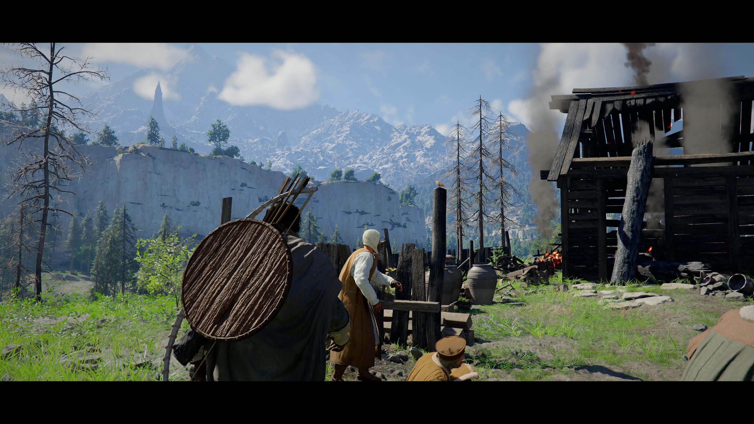 Un personnage près d'une structure en feu dans Crimson Desert