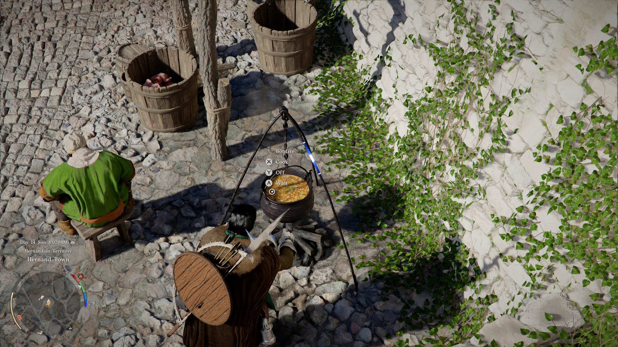 Un personnage en tenue médiévale interagissant avec un pot de cuisine dans le cadre du jeu 'Hernand Town', montrant les options 'Cook', 'Off' et 'Wait.'