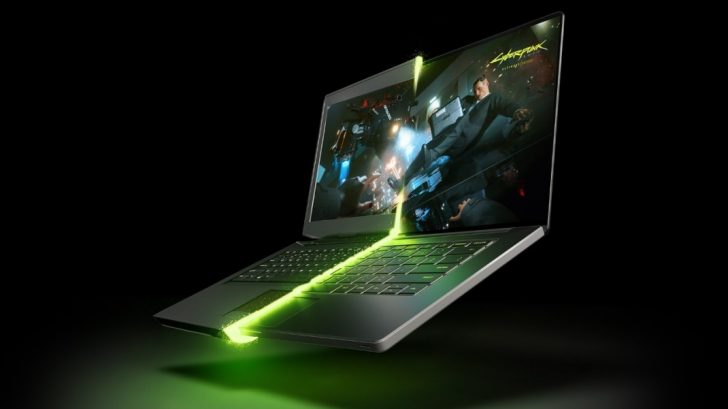 Un ordinateur portable de jeu affichant 'Cyberpunk 2077' avec un effet lumineux vert
