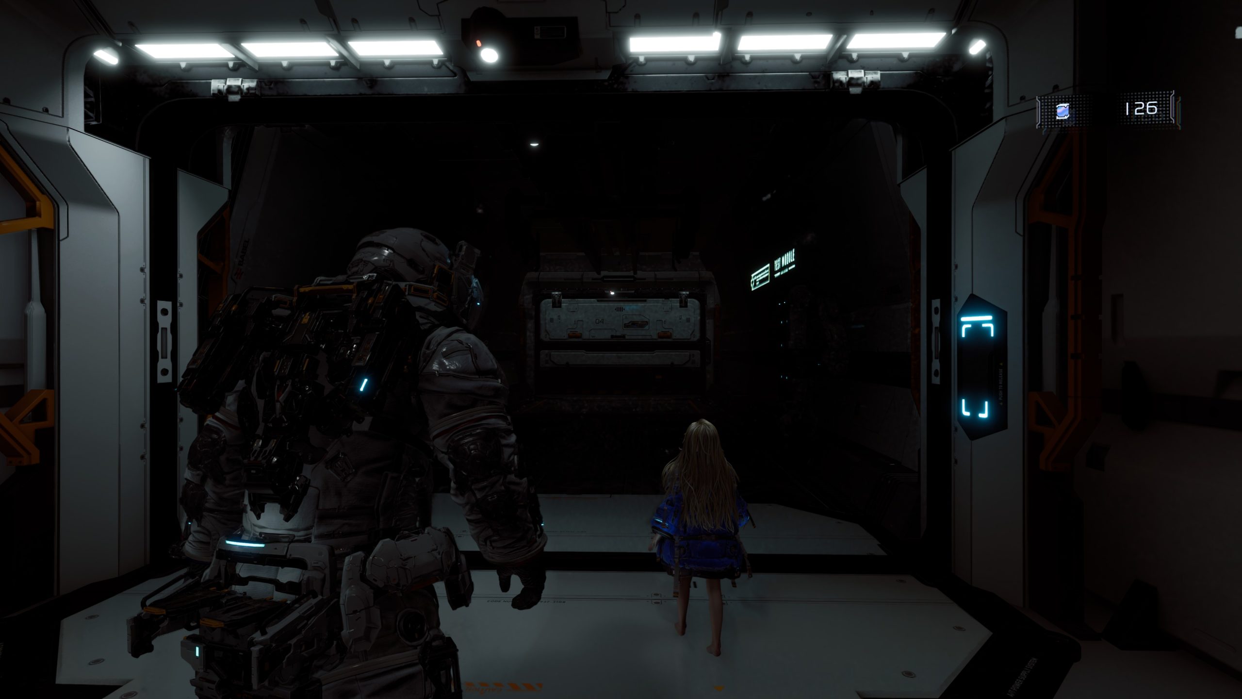 A character in a futuristic spacesuit stands next to a girl in a blue coat inside a dimly lit spacecraft corridor, with a door labeled 'DEAD SPACE.'