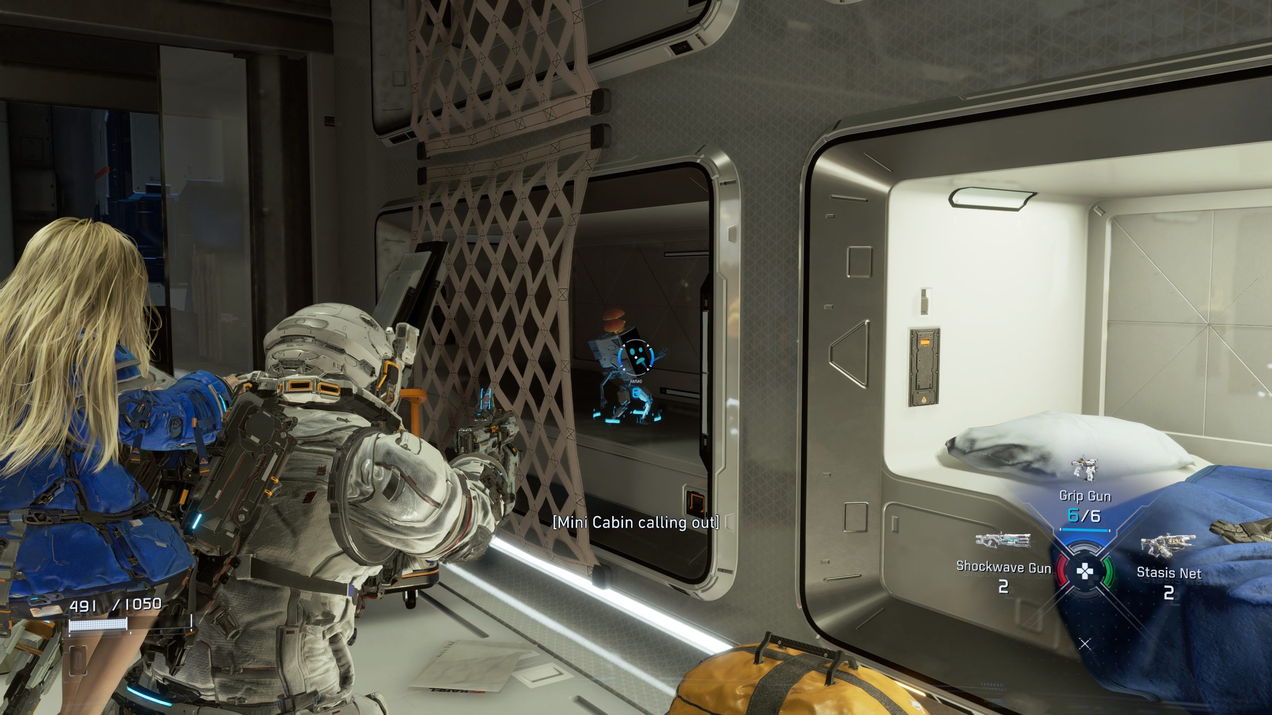 A scene from the game PRAGMATA shows two characters interacting inside a futuristic cabin, with an on-screen menu displaying weapons labeled 'Grip Gun,' 'Shockwave Gun,' and 'Stasis Net.'