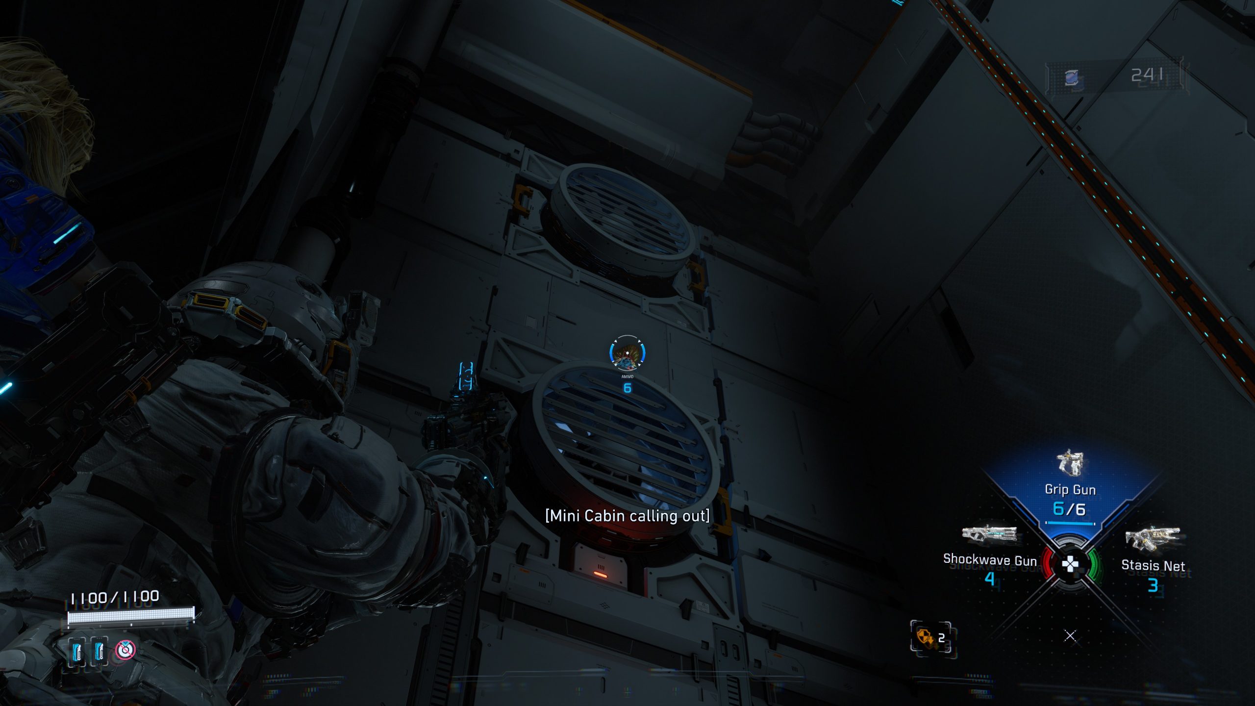 A character in PRAGMATA interacts with a vent labeled 'Mini Cabin calling out,' showcasing the grip gun and weapon inventory on screen.