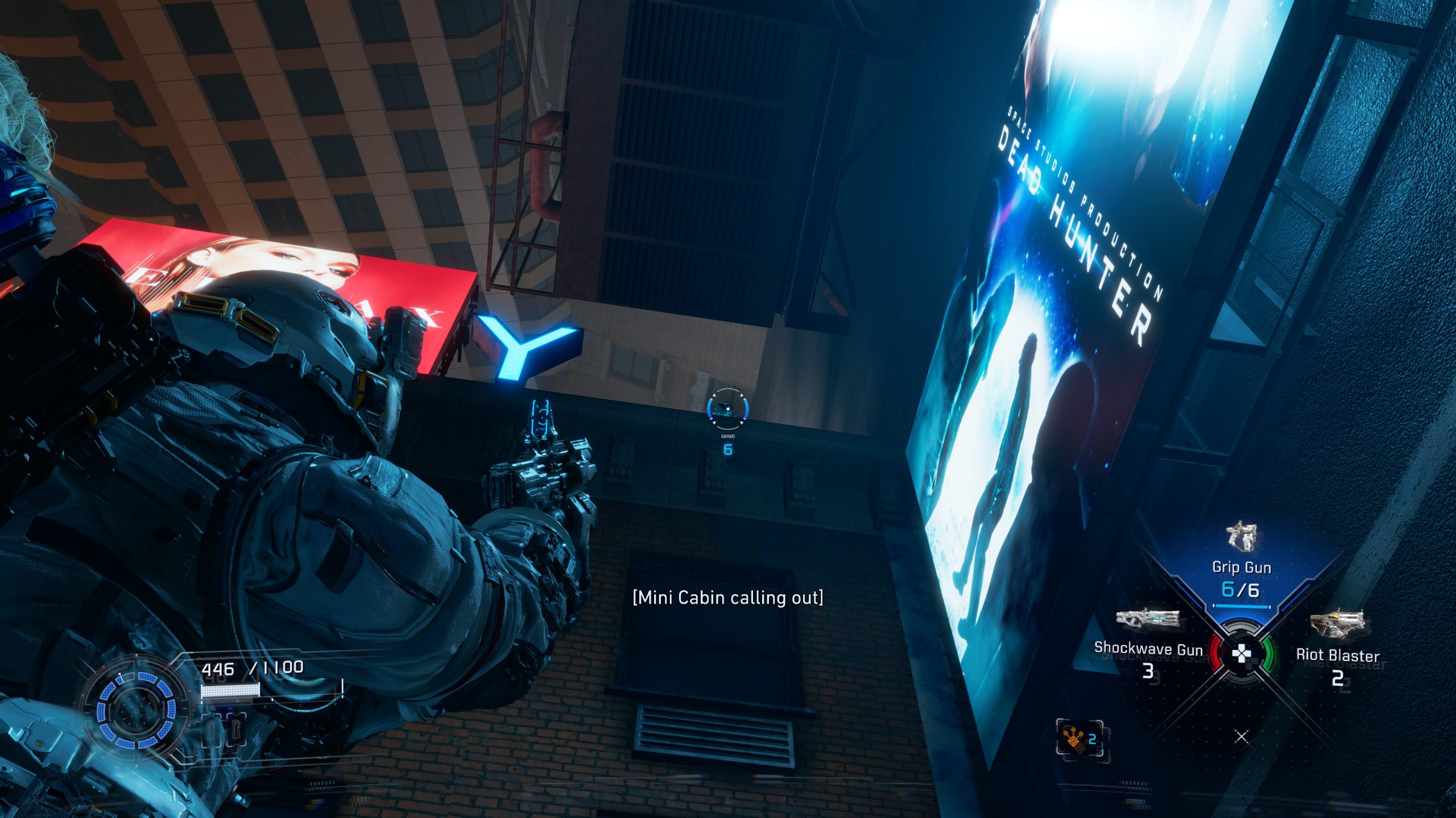 A character in spacesuit gear in PRAGMATA aims their weapon in a futuristic city setting with a digital display showing weapon stats, including 'Grip Gun' and 'Shockwave Gun', while the subtitle '[Mini Cabin calling out]' appears on the screen.