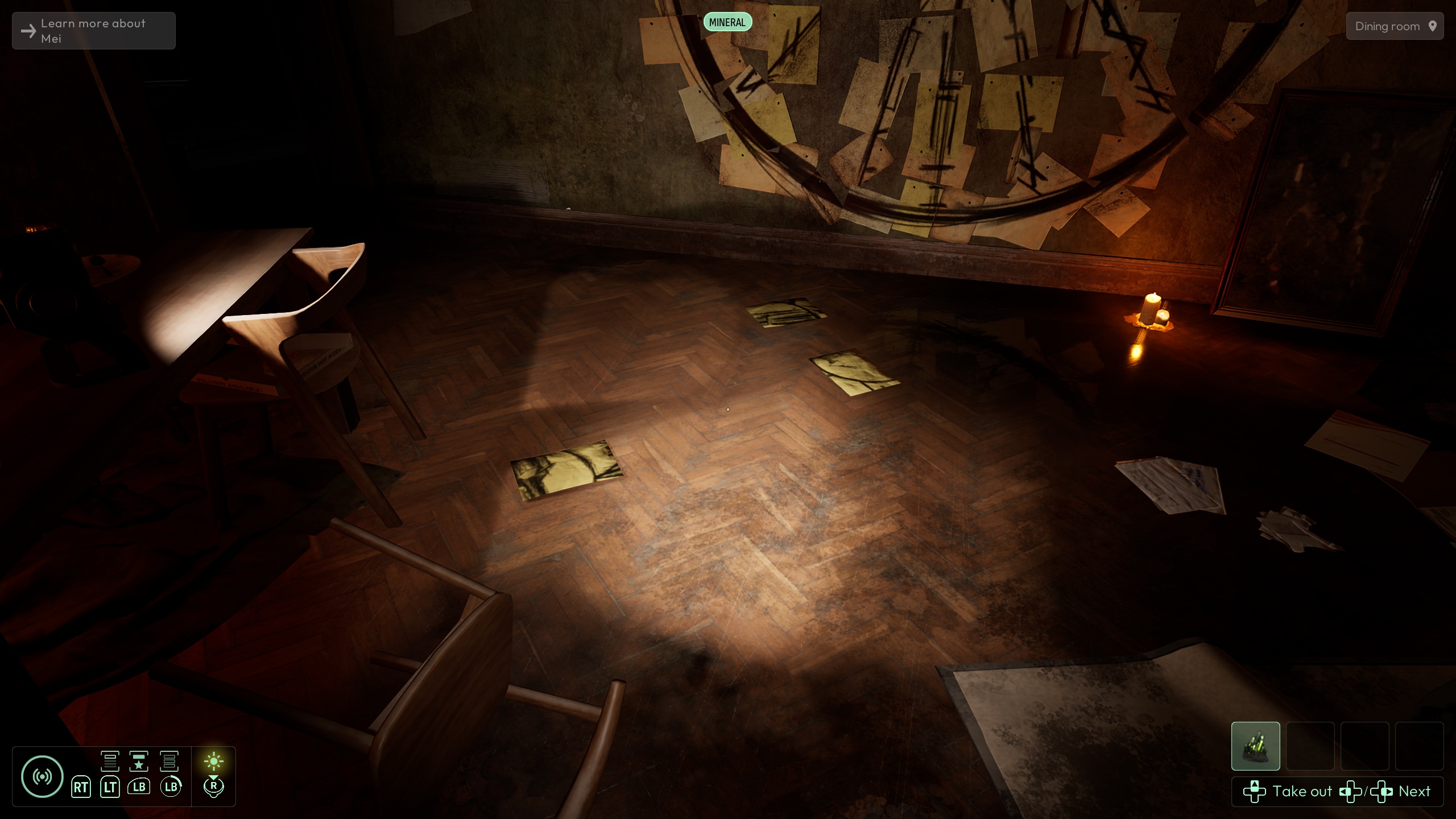 A dimly lit room in a video game shows a table, chairs, scattered papers, and a small candle on the floor with UI text reading 'Learn more about Mei' and 'Take out.'