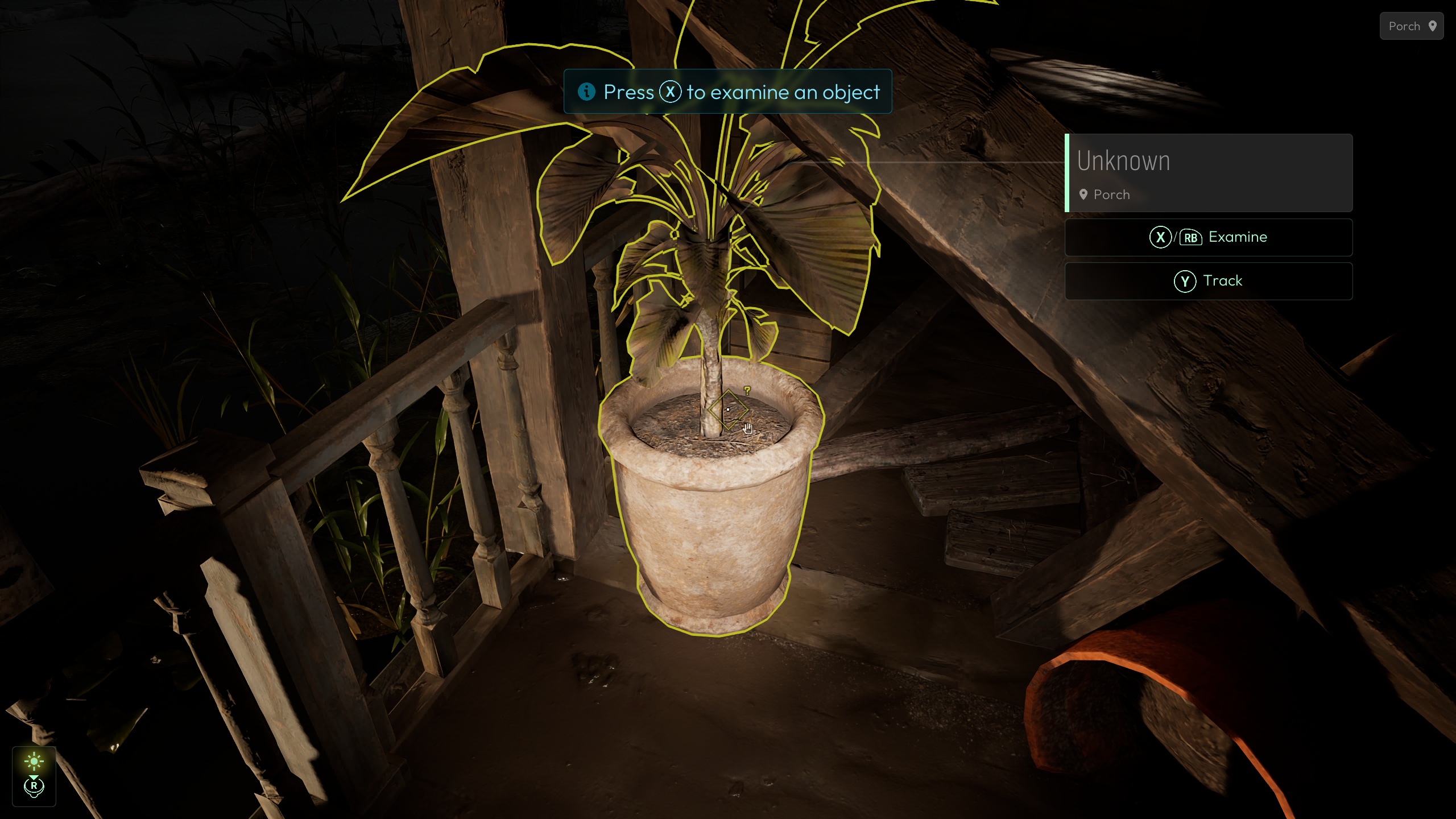 A potted plant highlighted in a video game with a prompt reading 'Press X to examine an object' and options to 'Examine' and 'Track' displayed on-screen.