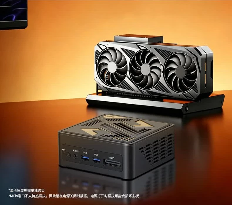 A graphics card with three fans is displayed alongside a compact, unbranded mini PC with multiple ports on the front, set against an orange background.