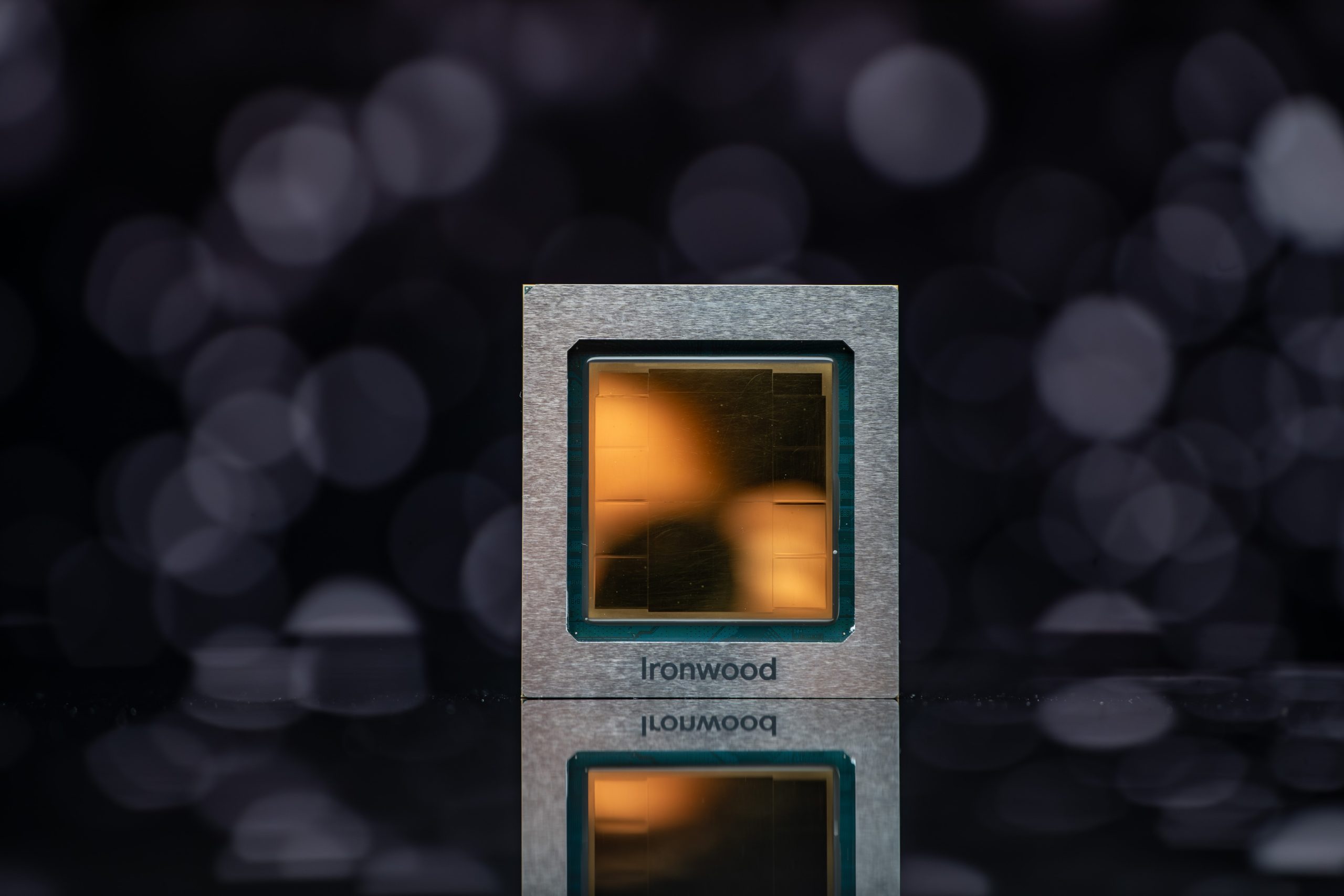 A reflective close-up of a square chip labeled Ironwood with a blurred bokeh background.