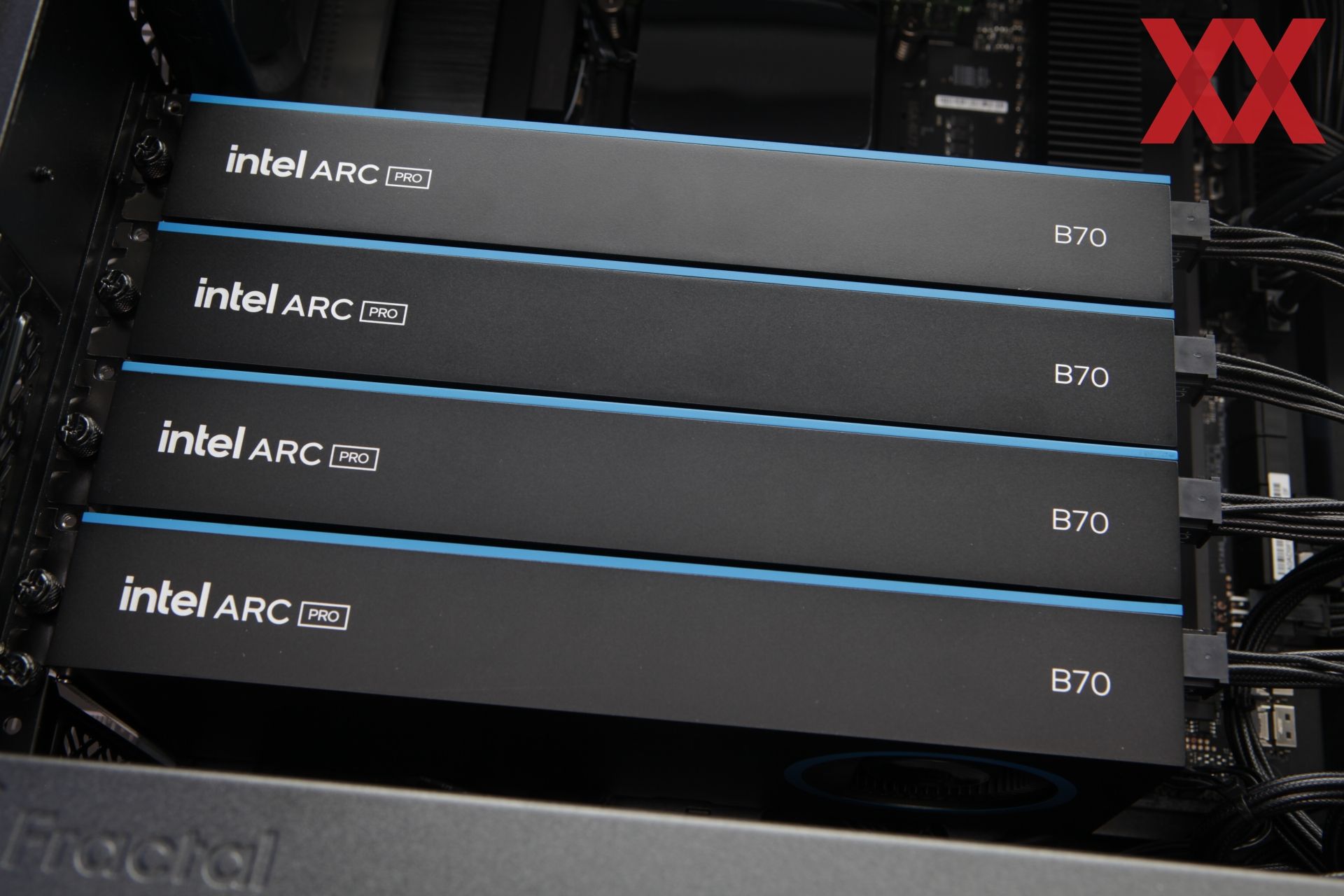 Four Intel Arc Pro B70 graphics cards are installed in a computer case.