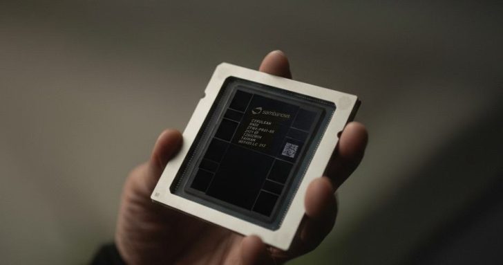 A person holds a semiconductor chip with visible text, 'sambanova,' labeled 'CEREBRAS 500K M2019-05' and 'TITANIUM.'
