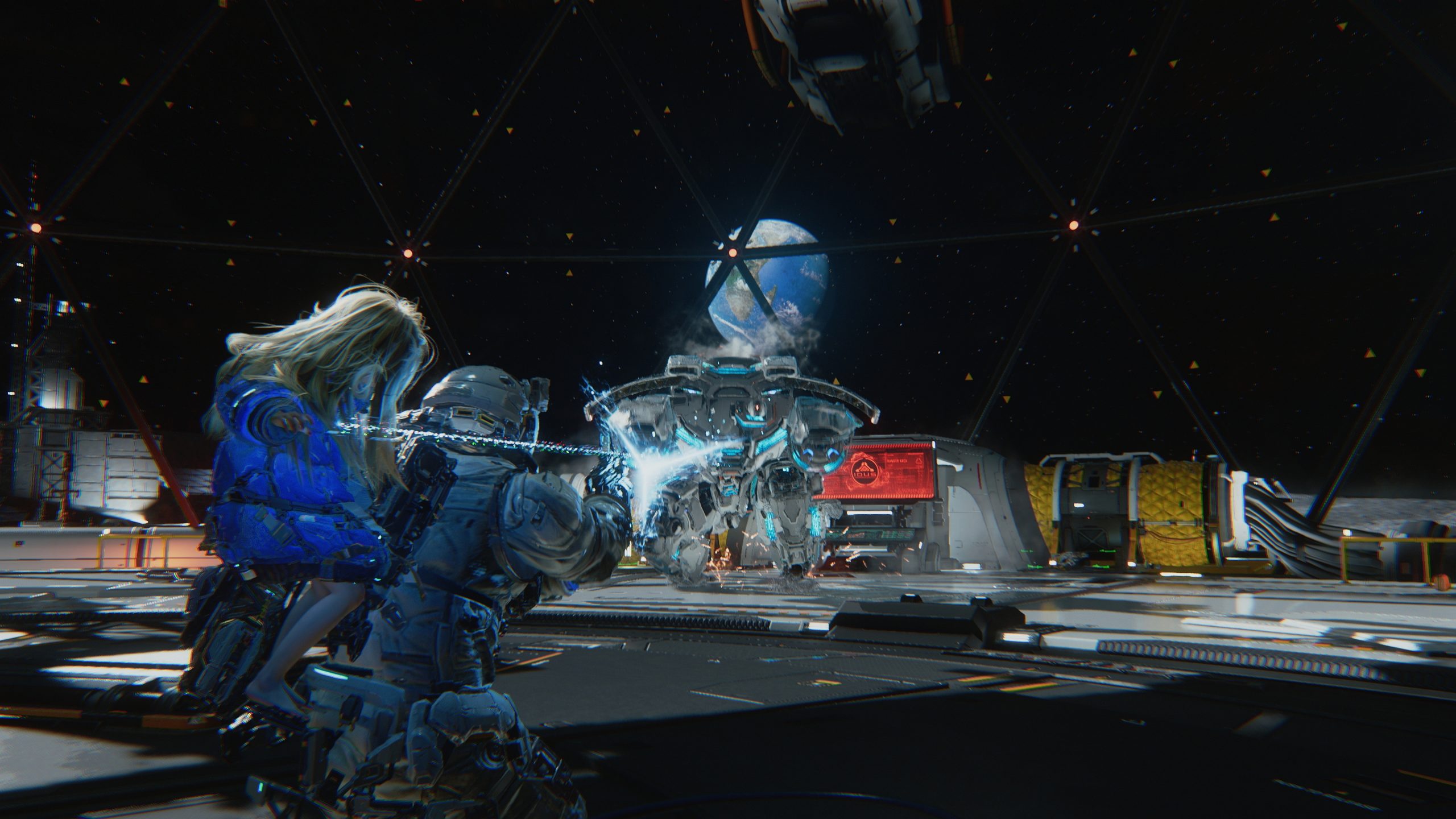A character in futuristic armor shoots a beam at a hovering robot inside a space station, with Earth visible in the background.