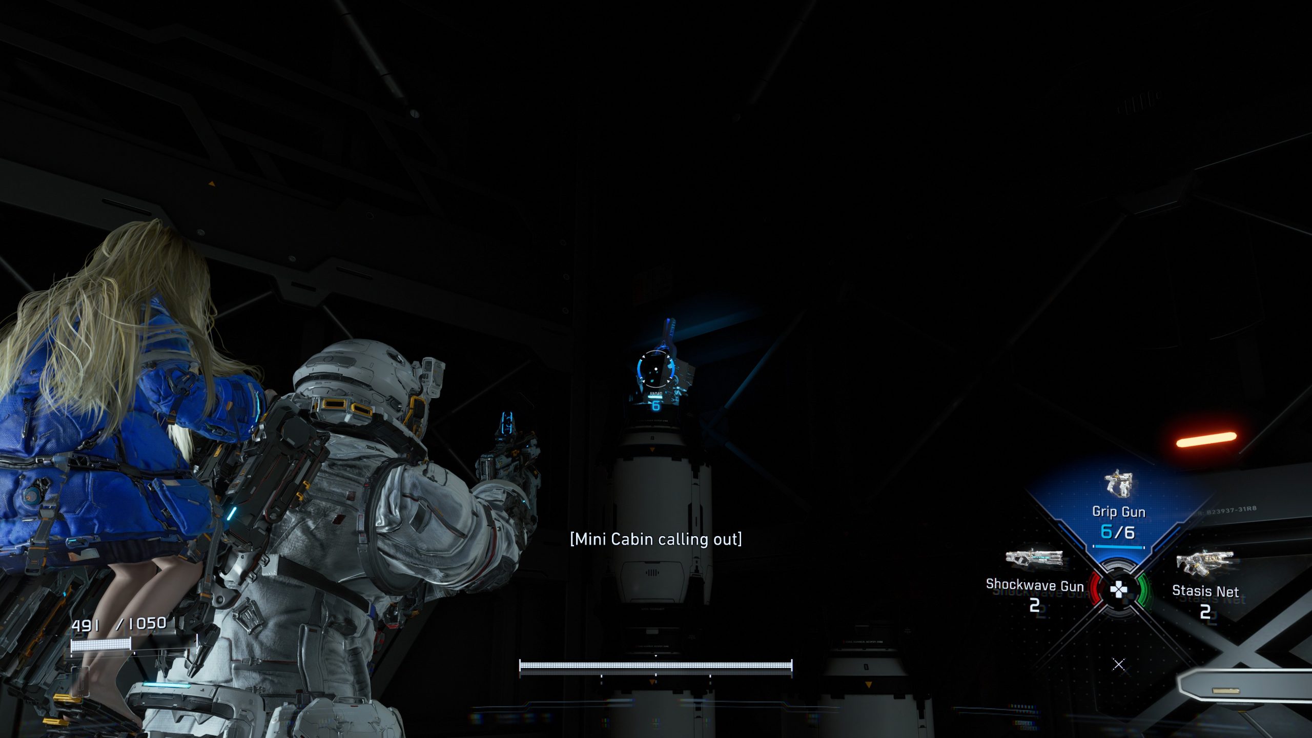 A character in a space suit from the game 'Pragmata' stands with a girl on their back, aiming a 'Grip Gun 6/6' at a container labeled '[Mini Cabin calling out]'.