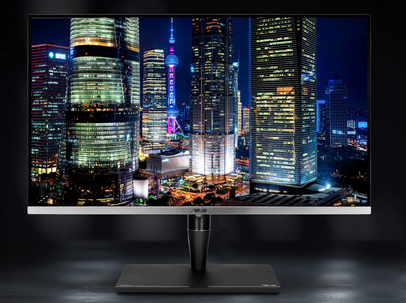 The ProArt Mini-LED monitor on a grey table.