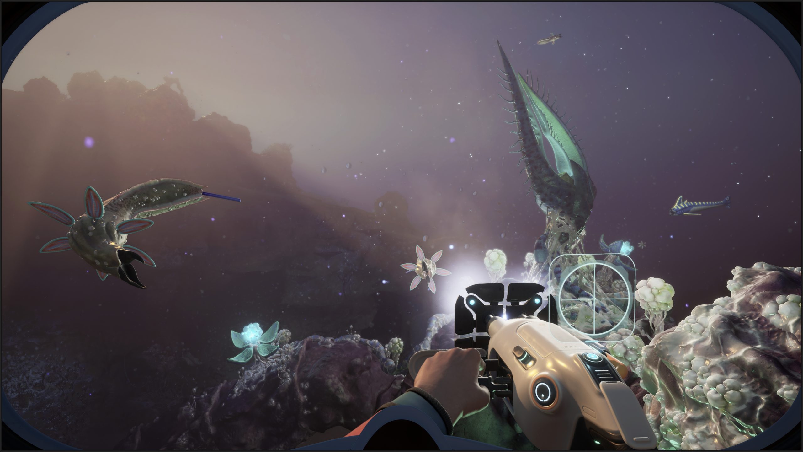A character in the game 'Subnautica 2' explores an underwater environment using a handheld device while encountering various alien sea creatures.