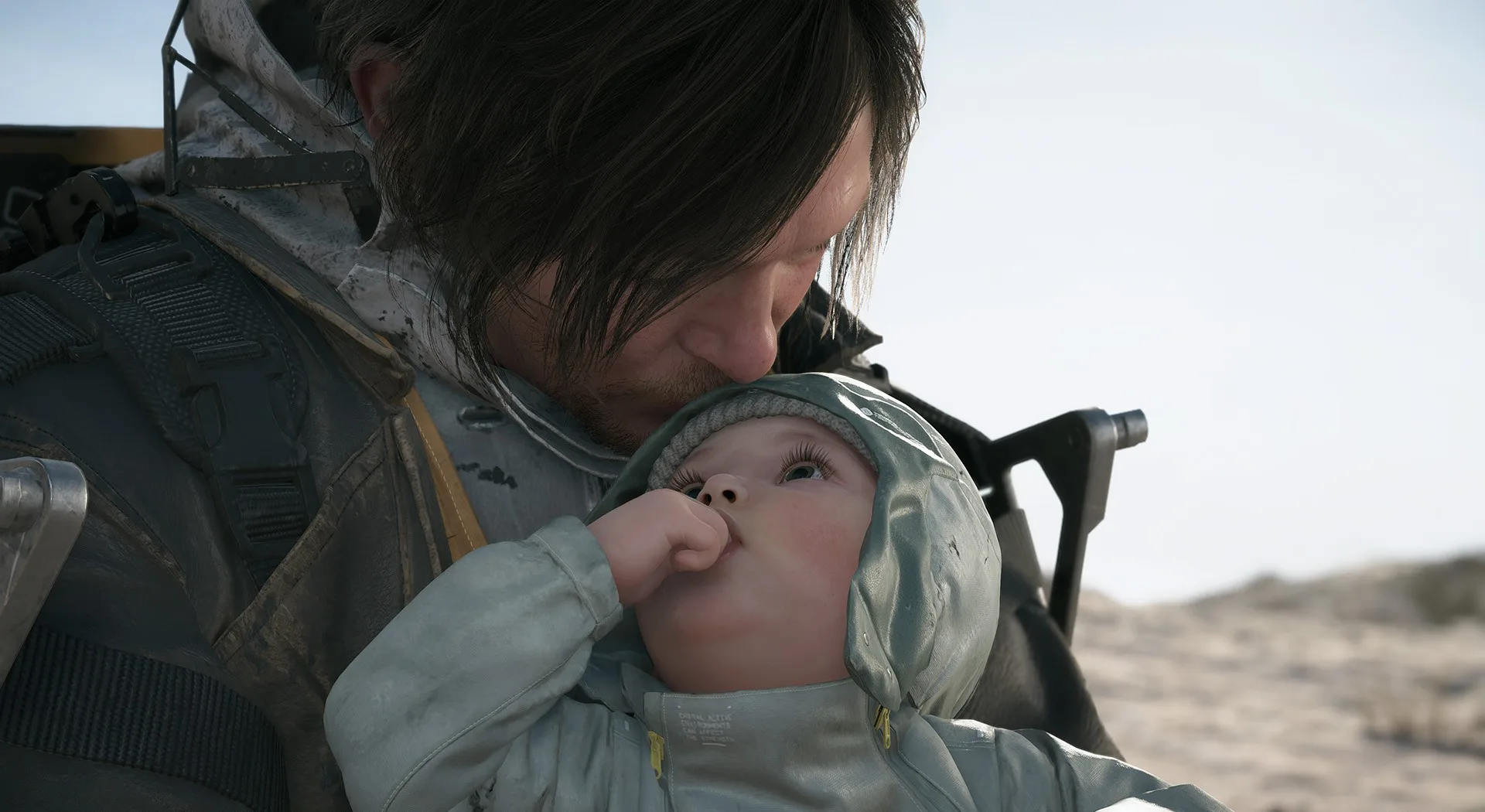 Sam tient Lou dans Death Stranding 2: On The Beach.