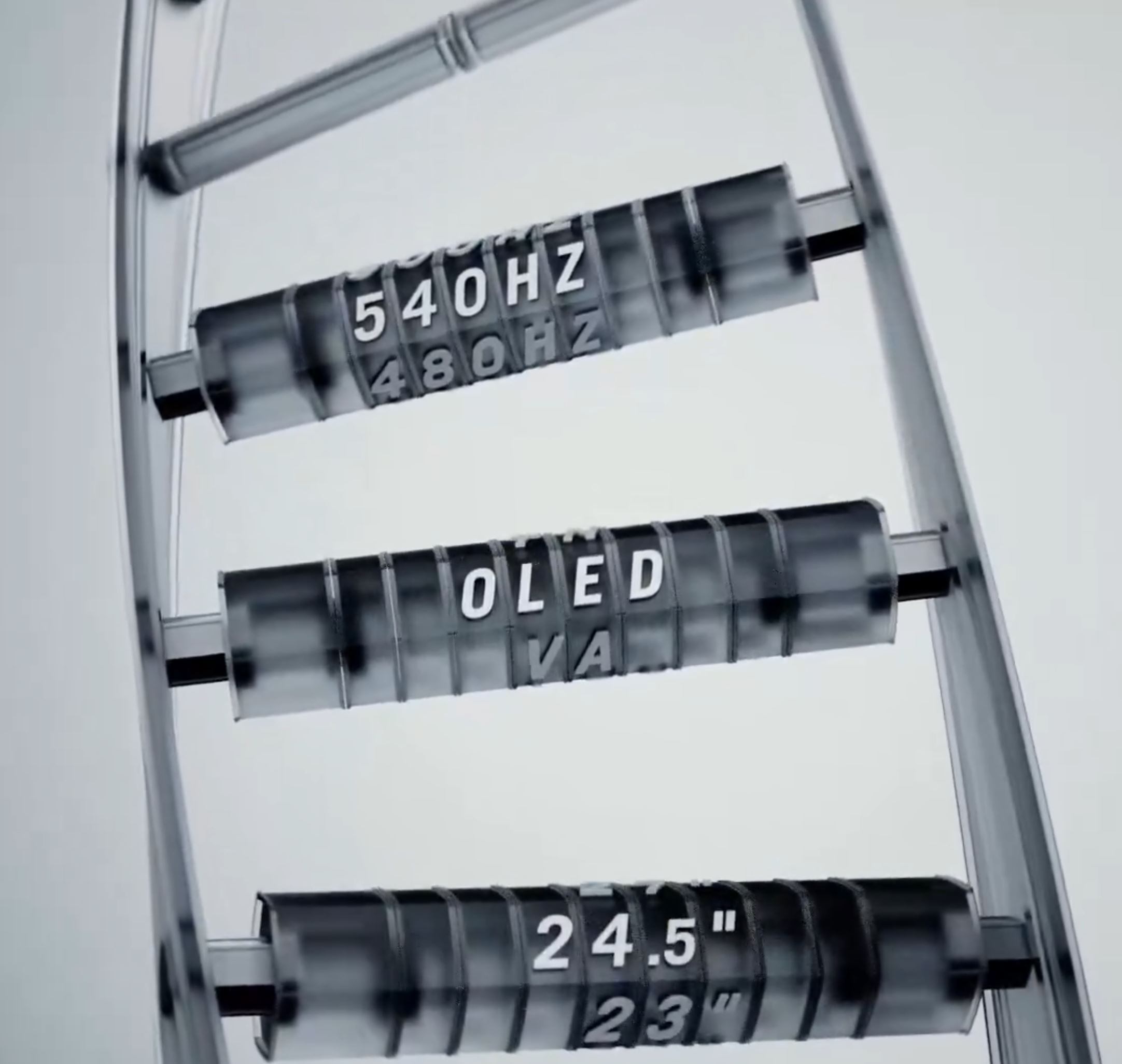 Une image en gros plan montre des éléments d'affichage rotatifs avec les textes '540Hz', 'OLED' et '24.5' sur des cylindres transparents.