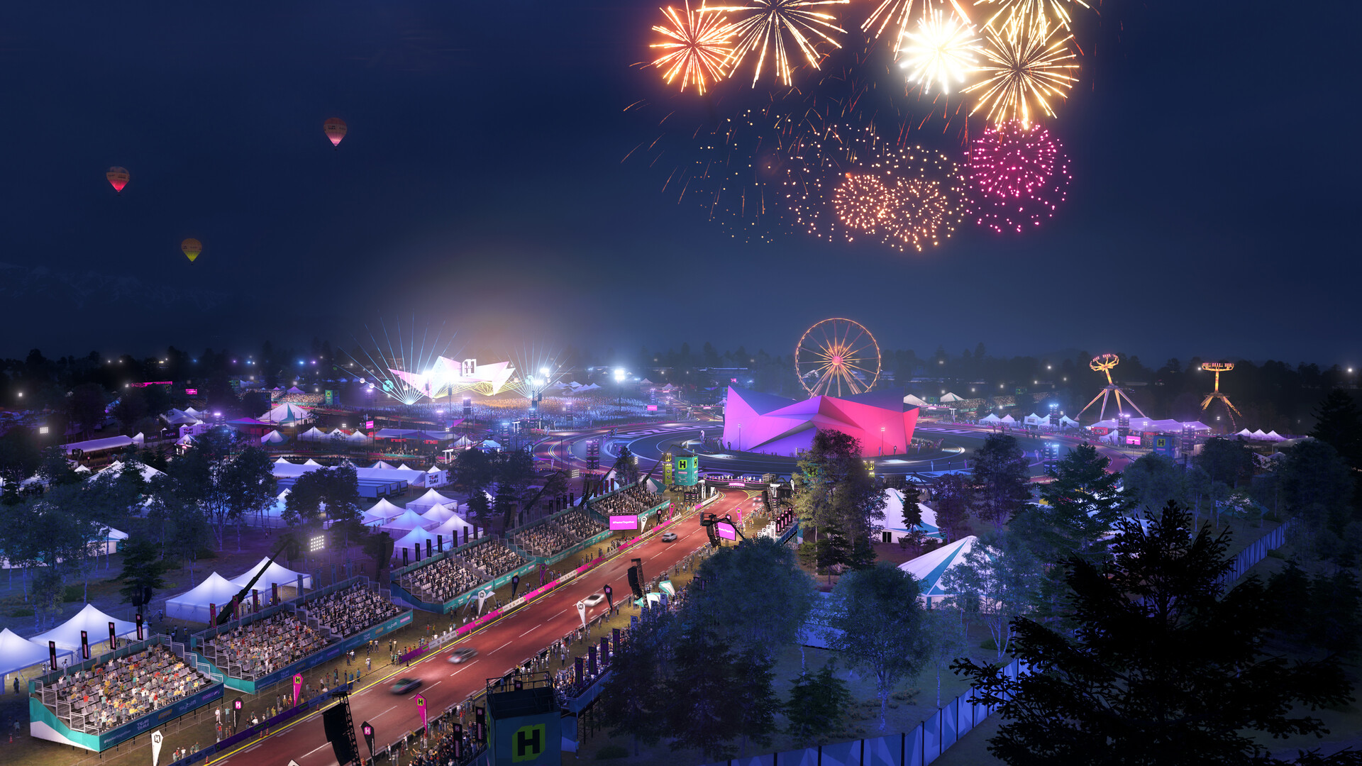 Piste de course illuminée et décor festif de nuit dans un jeu vidéo, avec des structures lumineuses, une grande roue et des feux d'artifice dans le ciel.