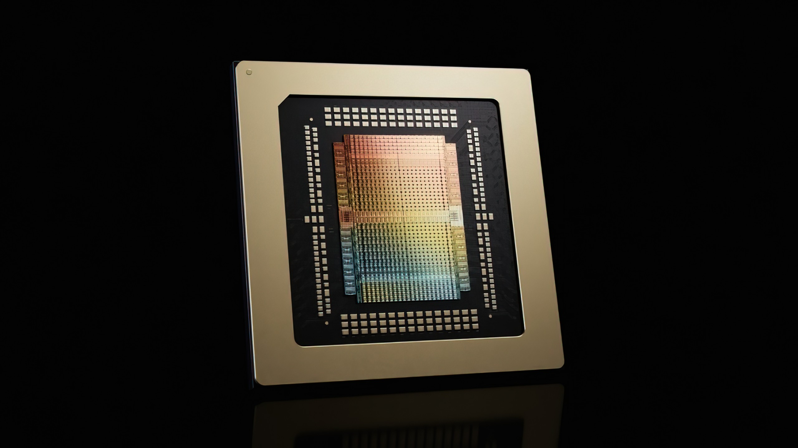 A close-up image of the AMD MI300X GPU, featuring its intricate circuit design against a black background.