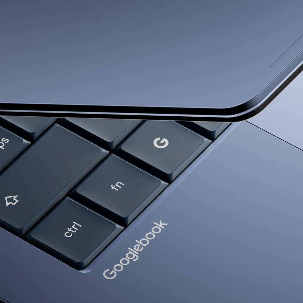 A close-up of a laptop keyboard showing the brand name 'Googlebook' and a 'G' key.