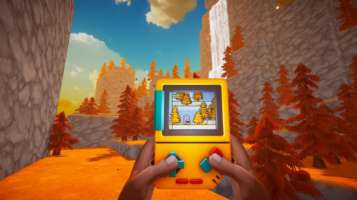 Une personne tient une console portable jaune affichant un jeu en pixels, dans un paysage automnal aux arbres orange.