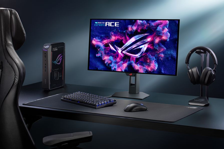 Un setup gaming ASUS ROG avec un moniteur affichant le logo ROG et le texte 'MADE FOR ESPORTS ACE', un clavier, une souris, un casque et un accessoire ROG sur un bureau.