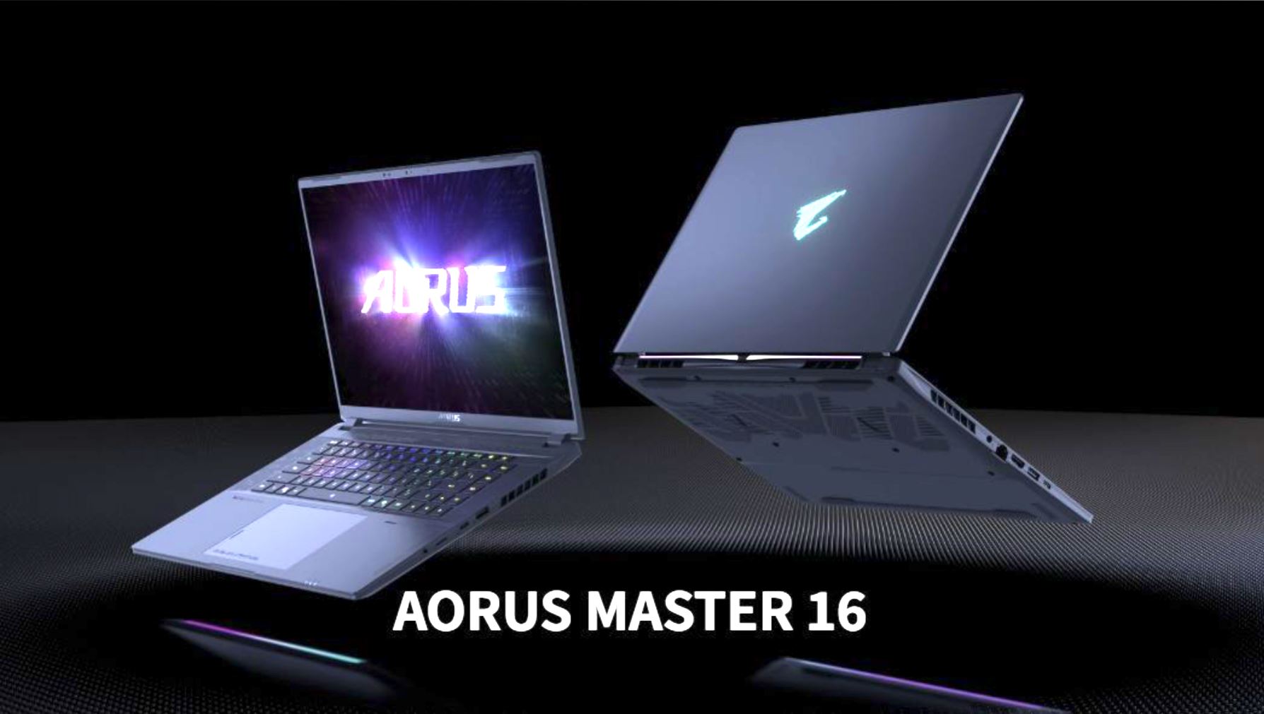 Deux PC portables affichant le logo AORUS, avec le texte 'AORUS MASTER 16' en bas.
