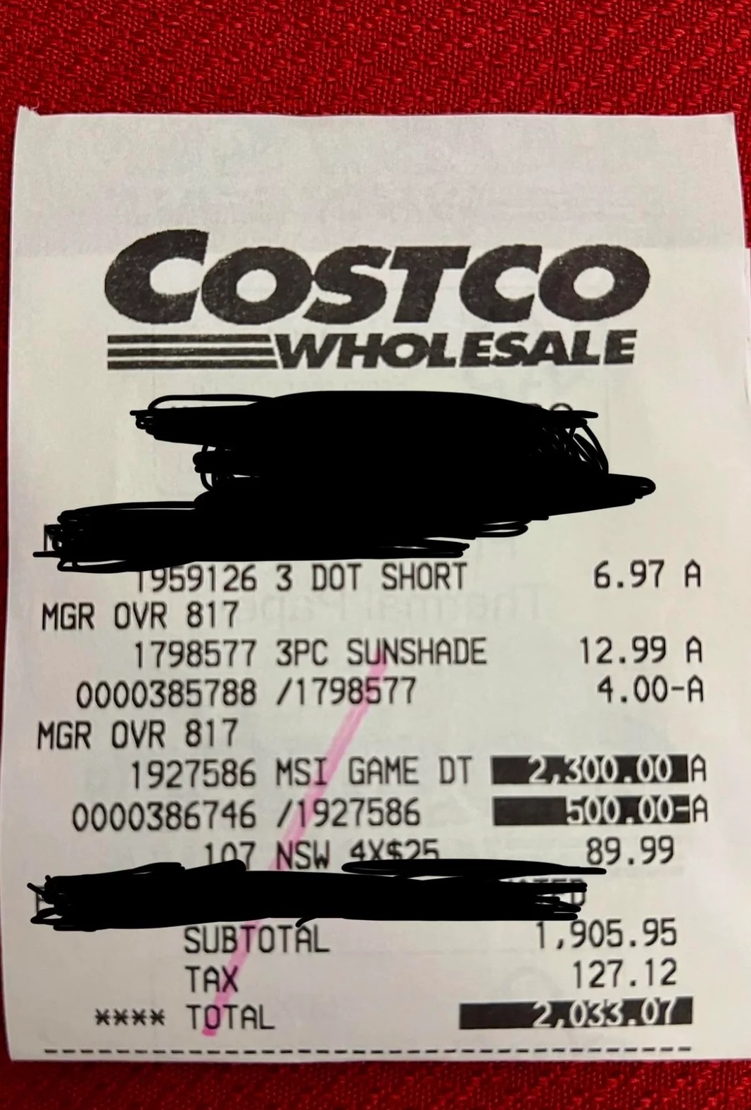 Ticket de caisse Costco détaillant un achat : 'MSI Game DT' à 2 300,00 €, '3 Dot Short' à 6,97 €, et '3PC Sunshade' avec remise, total 2 033,07 €.
