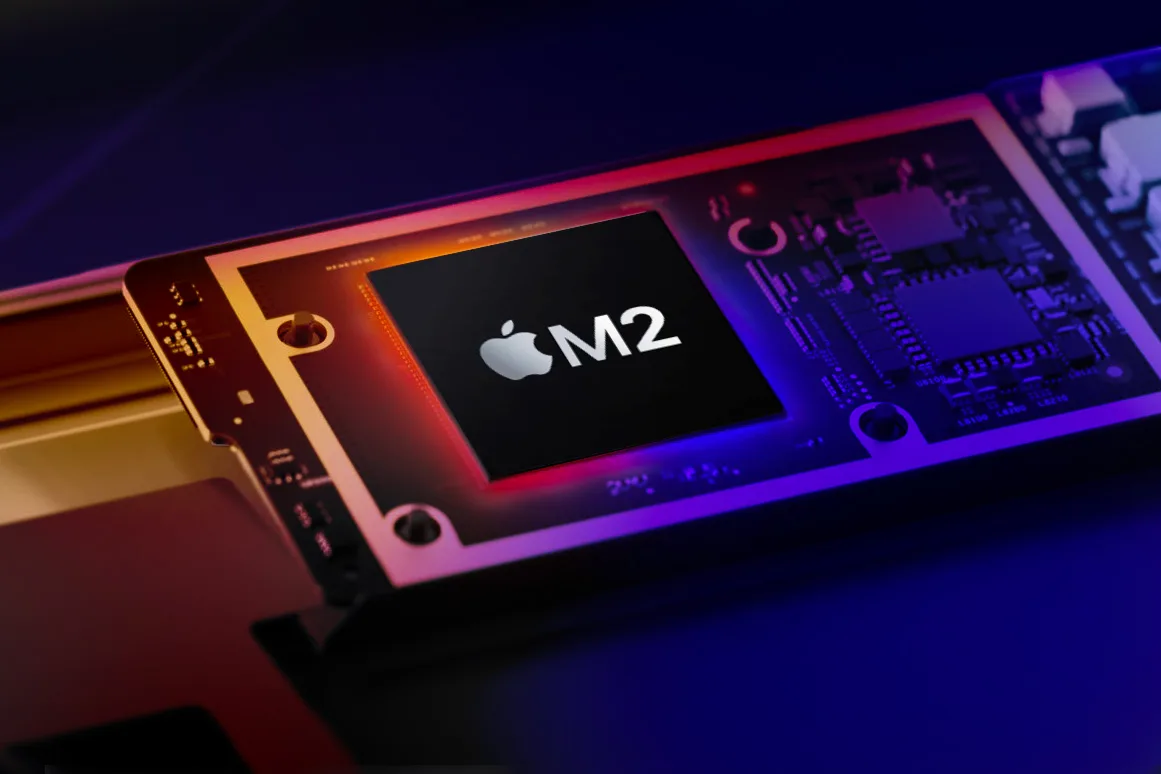 Une puce Apple M2 sur un fond dégradé stylisé.