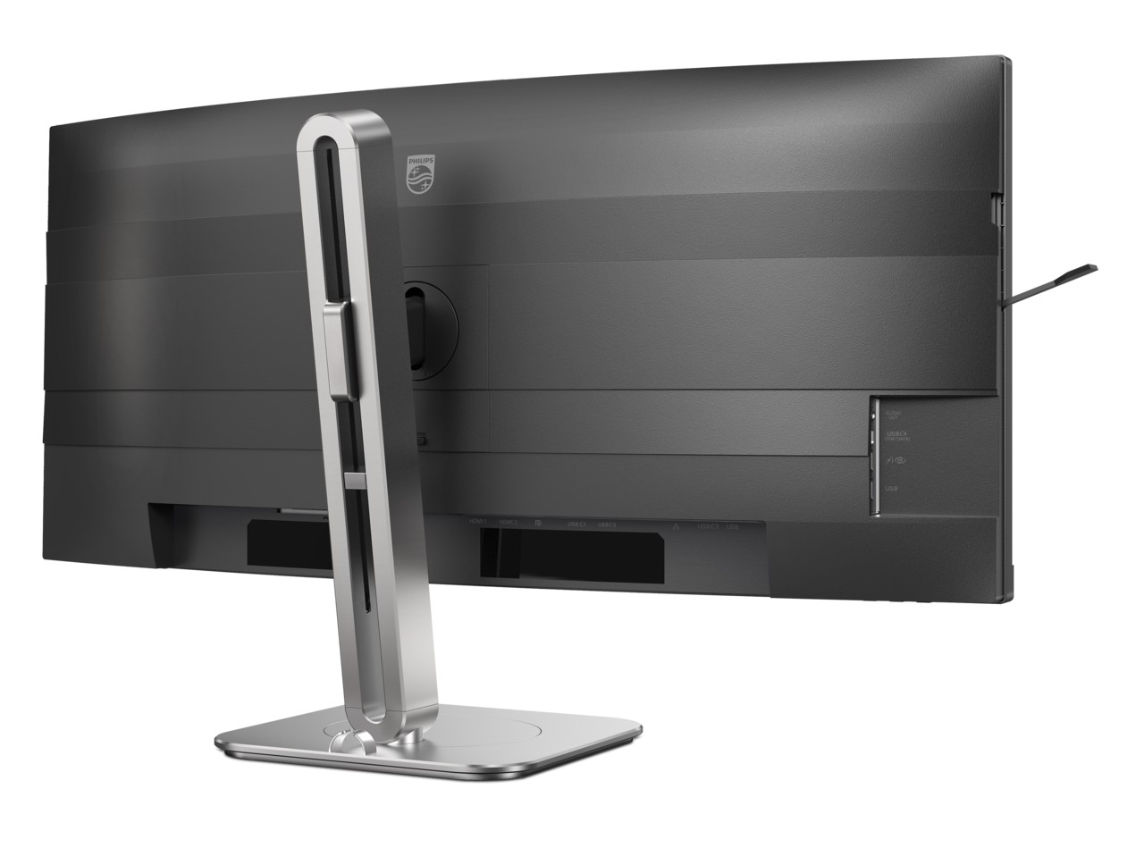 Vue arrière d'un moniteur Philips avec un pied argenté, montrant différents ports étiquetés HDMI, DP, USB-C et USB.
