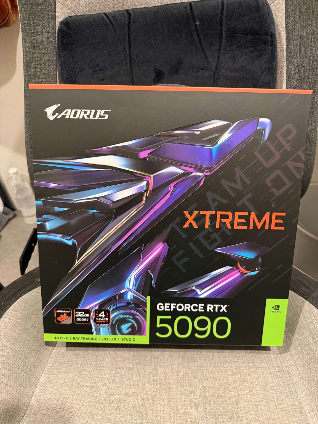 A box for the AORUS GeForce RTX 5090 graphics card, featuring 'XTREME' branding and specifications like '32GB GDDR7' and 'DLSS 4'.