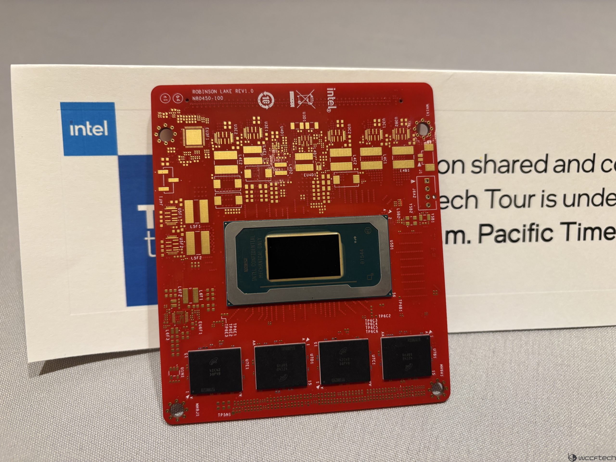 Intel circuit board labeled ROBINSON LAKE REV1.0 on a tech event table.